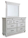 Kanwyn King Panel Bed with Mirrored Dresser, Chest and Nightstand
